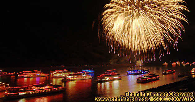 Boat cruise Rhine in Flames near Oberwesel on the Rhine River